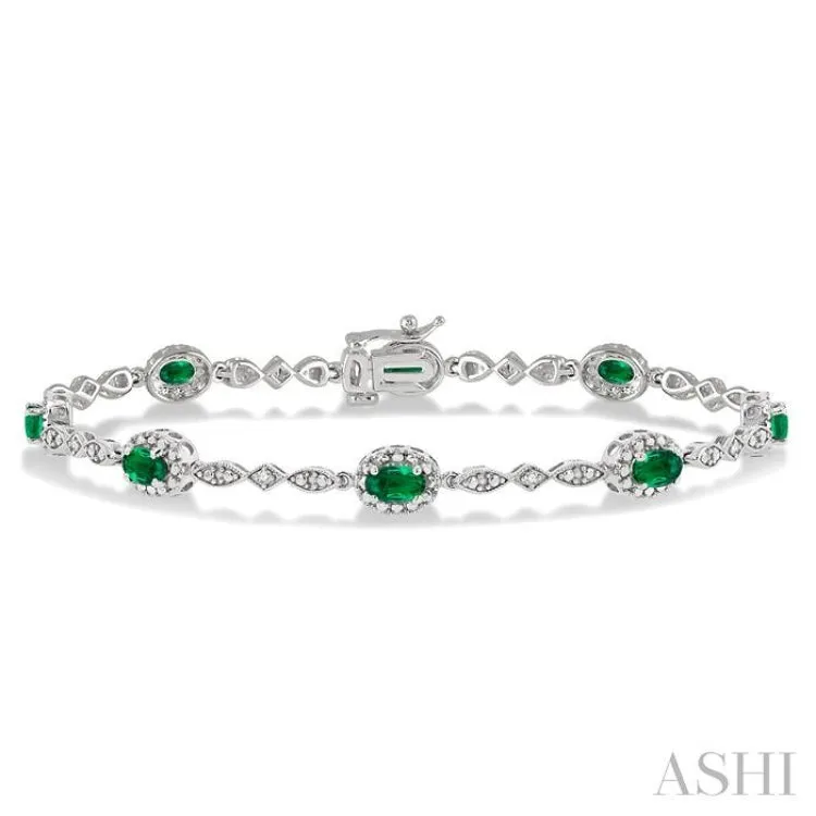 5x3 MM Oval Cut Emerald and 1/20 Ctw Single Cut Diamond Bracelet in 10K White Gold