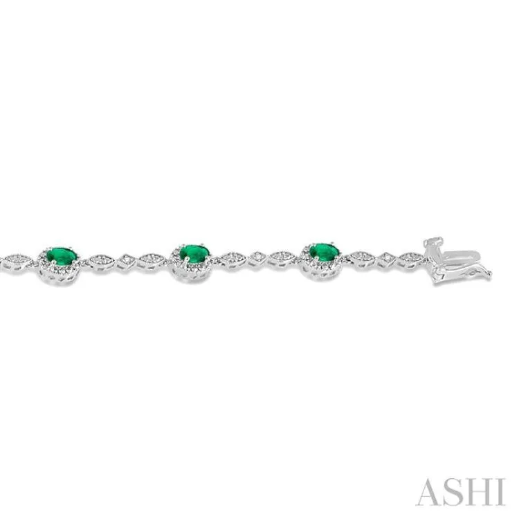 5x3MM Oval Cut Emerald and 1/20 Ctw Single Cut Diamond Bracelet in 10K White Gold