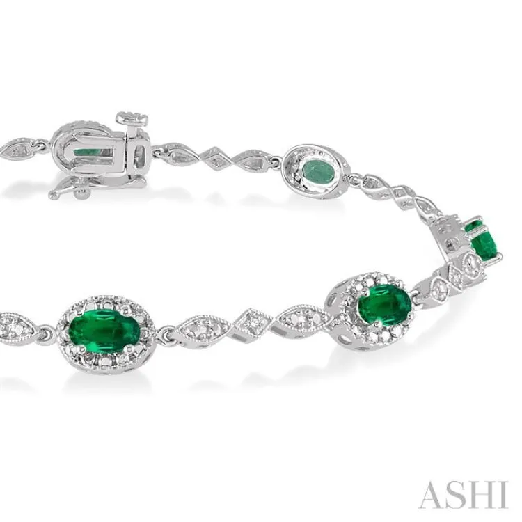 5x3MM Oval Cut Emerald and 1/20 Ctw Single Cut Diamond Bracelet in 10K White Gold