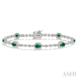 5x3MM Oval Cut Emerald and 1/20 Ctw Single Cut Diamond Bracelet in 10K White Gold