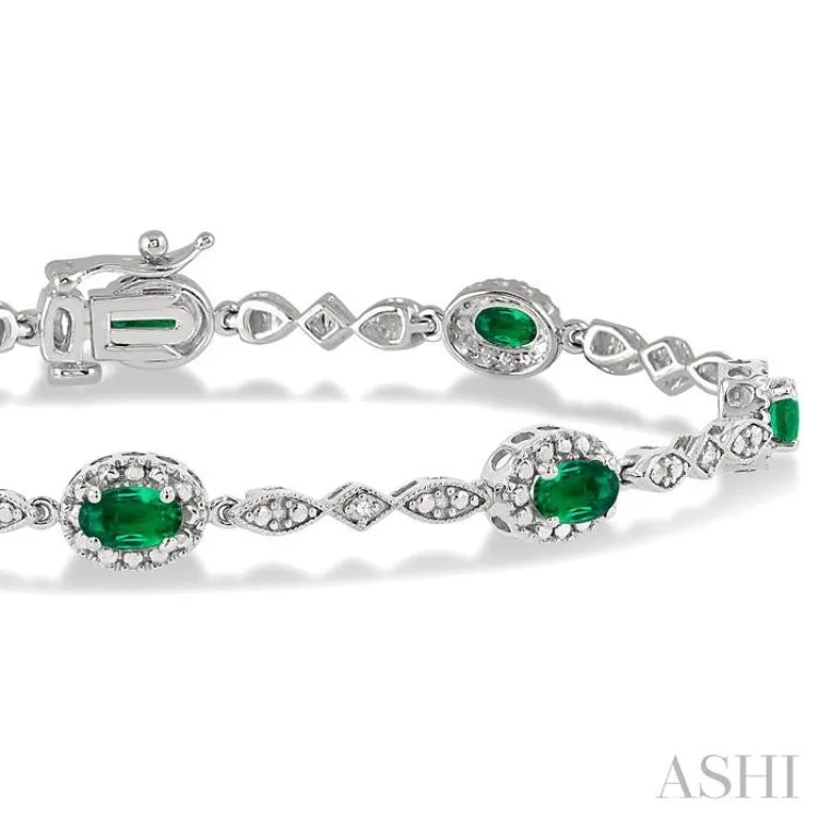 5x3MM Oval Cut Emerald and 1/20 Ctw Single Cut Diamond Bracelet in 10K White Gold