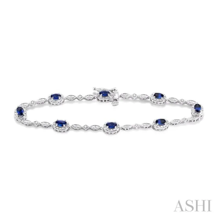 5x3MM Oval Cut Sapphire and 1/20 Ctw Single Cut Diamond Bracelet in 10K White Gold