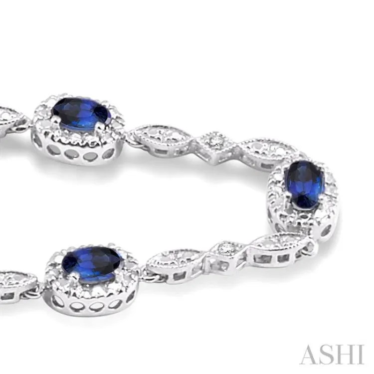 5x3MM Oval Cut Sapphire and 1/20 Ctw Single Cut Diamond Bracelet in 10K White Gold